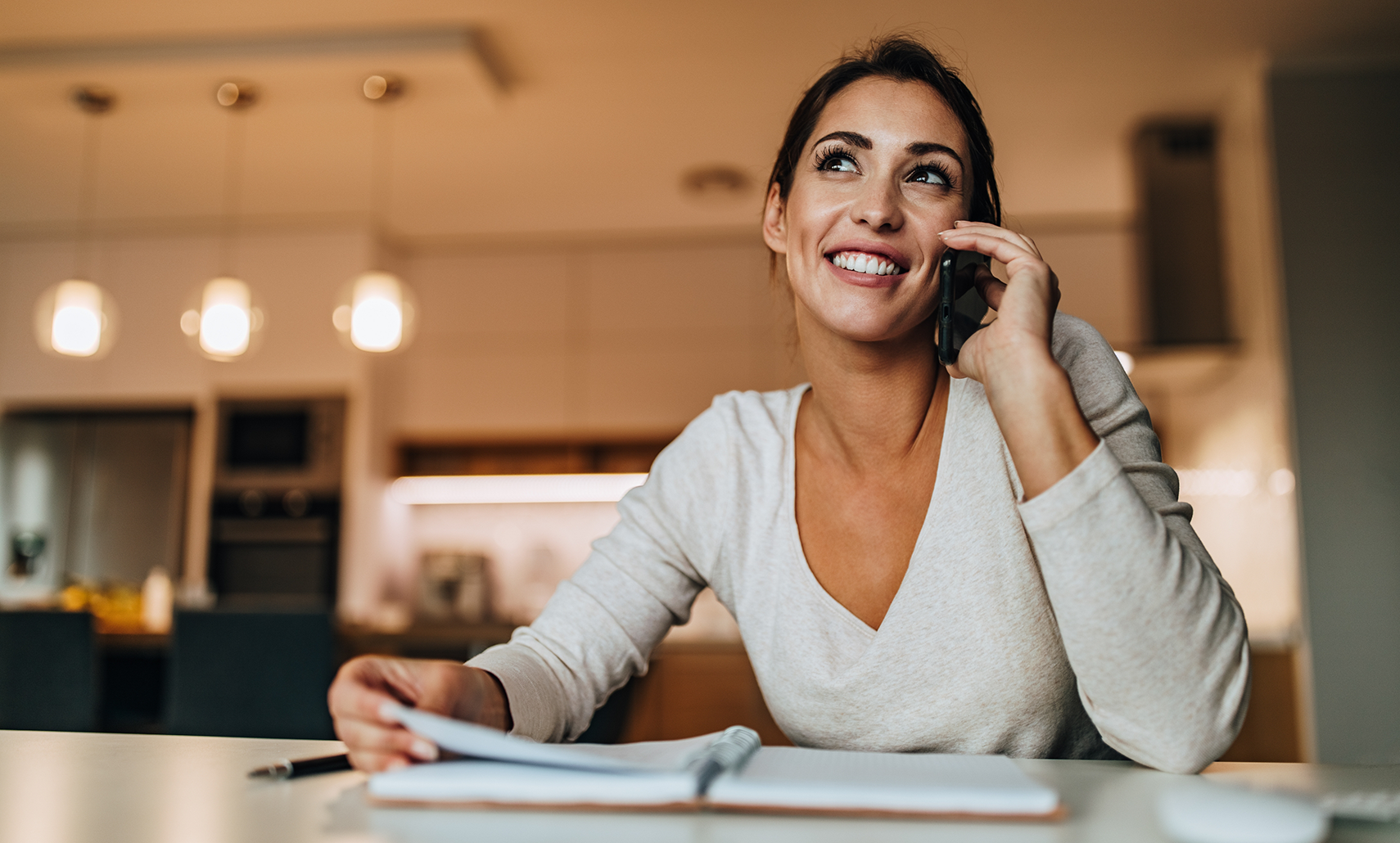 Woman talking on the phone with a Houston dental office