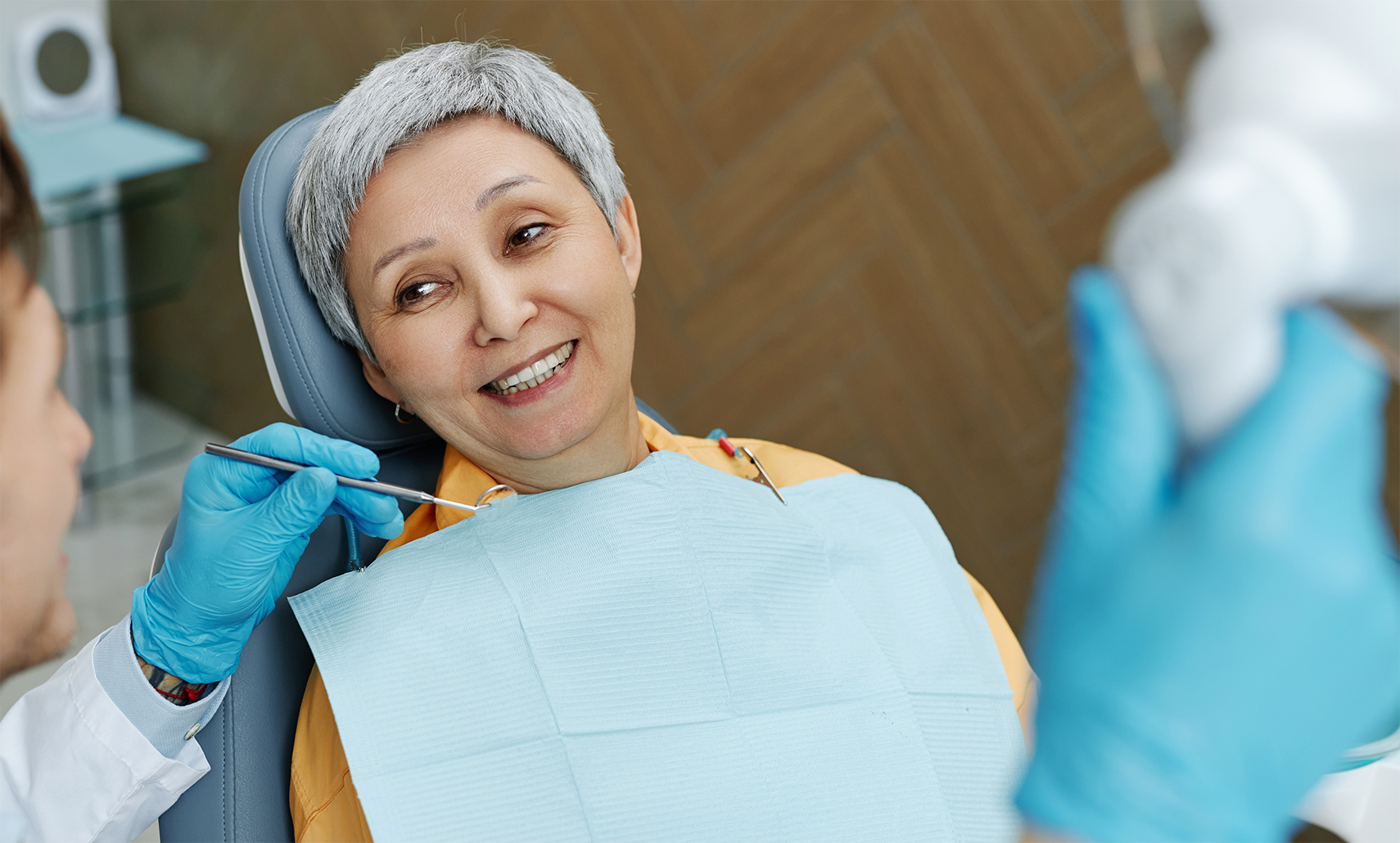 Woman smiling at her dentist during a preventive dental checkup